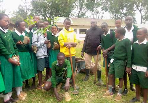 Planting trees with pupils of Leldet Primary School